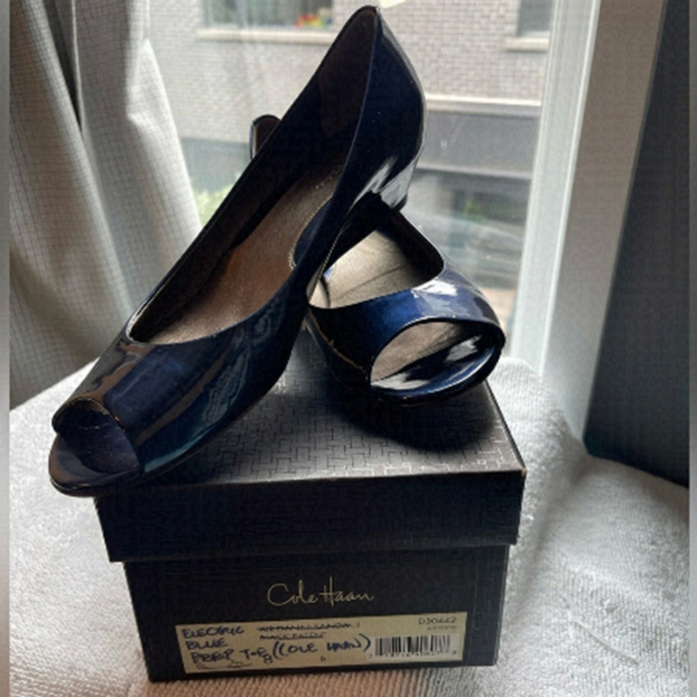 Blue patent Cole Haan open toed shoes.